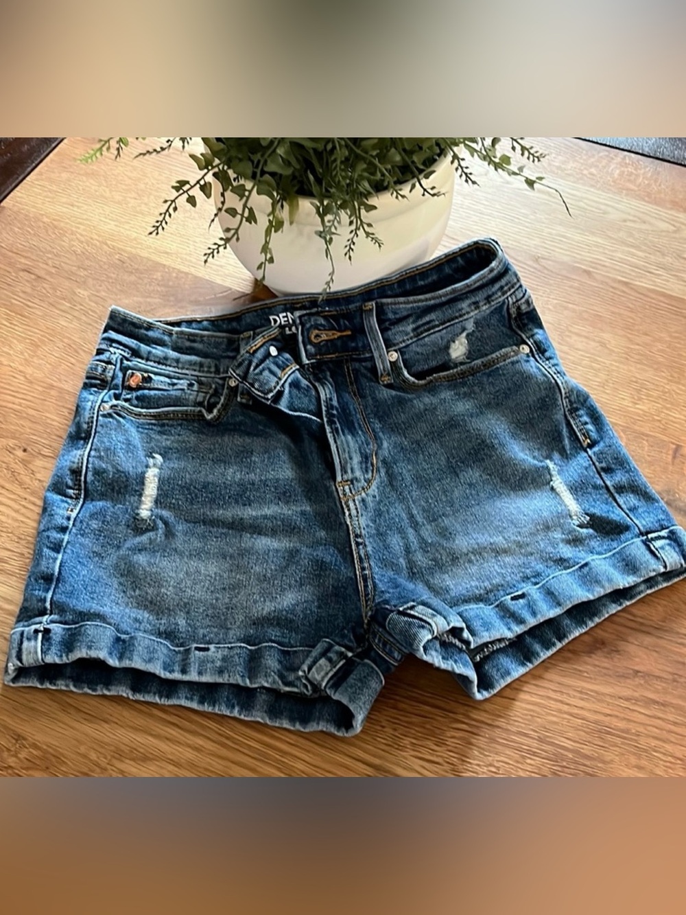 Denizen from Levi's Medium Blue Distressed High-Rise Jean Shorts. 25
